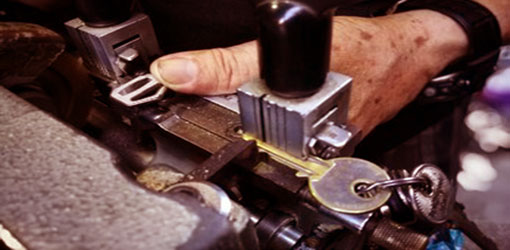 A hand using a machine to change the key