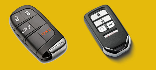 2 different car keys on a yellow background